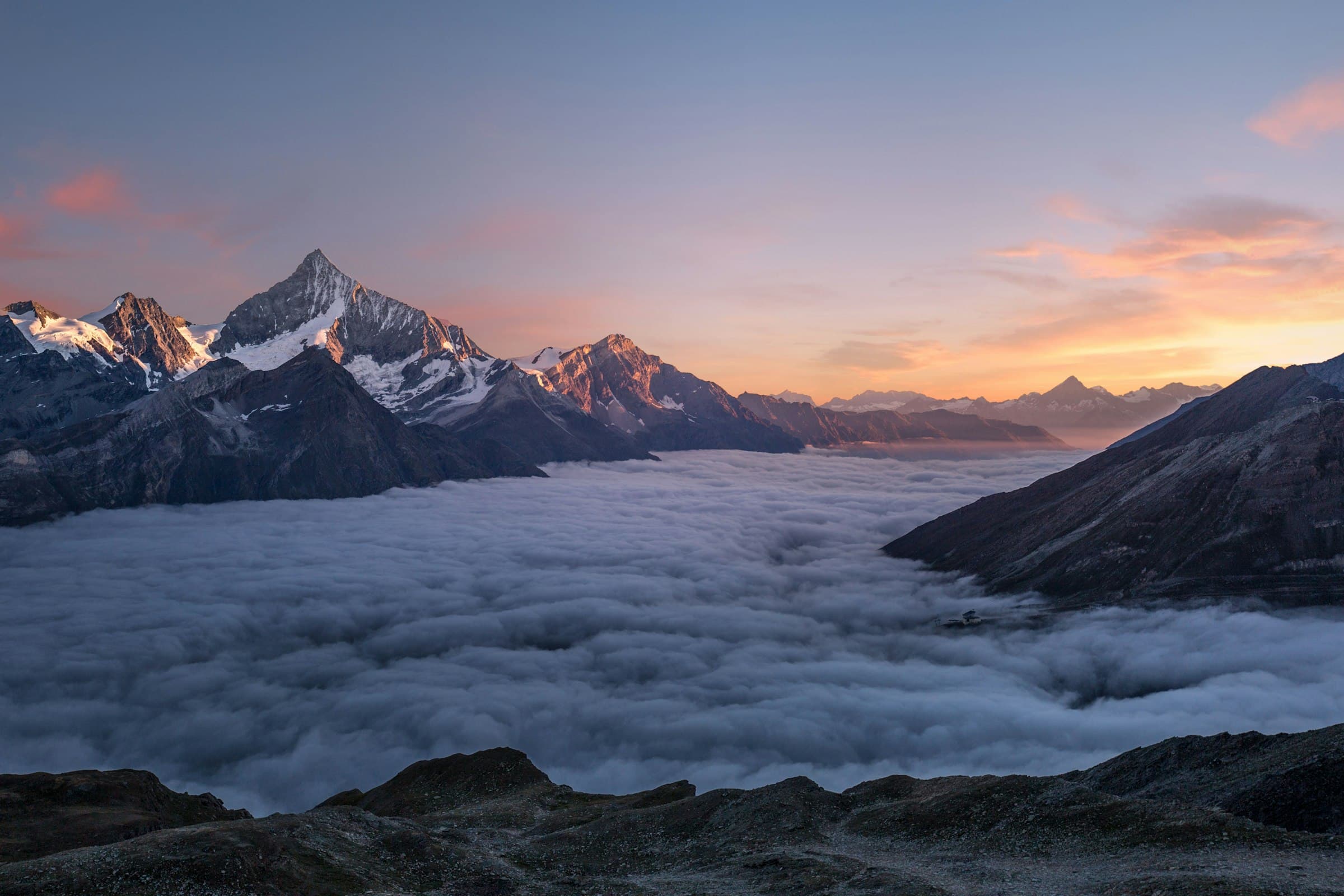 Sunset peaks above the clouds