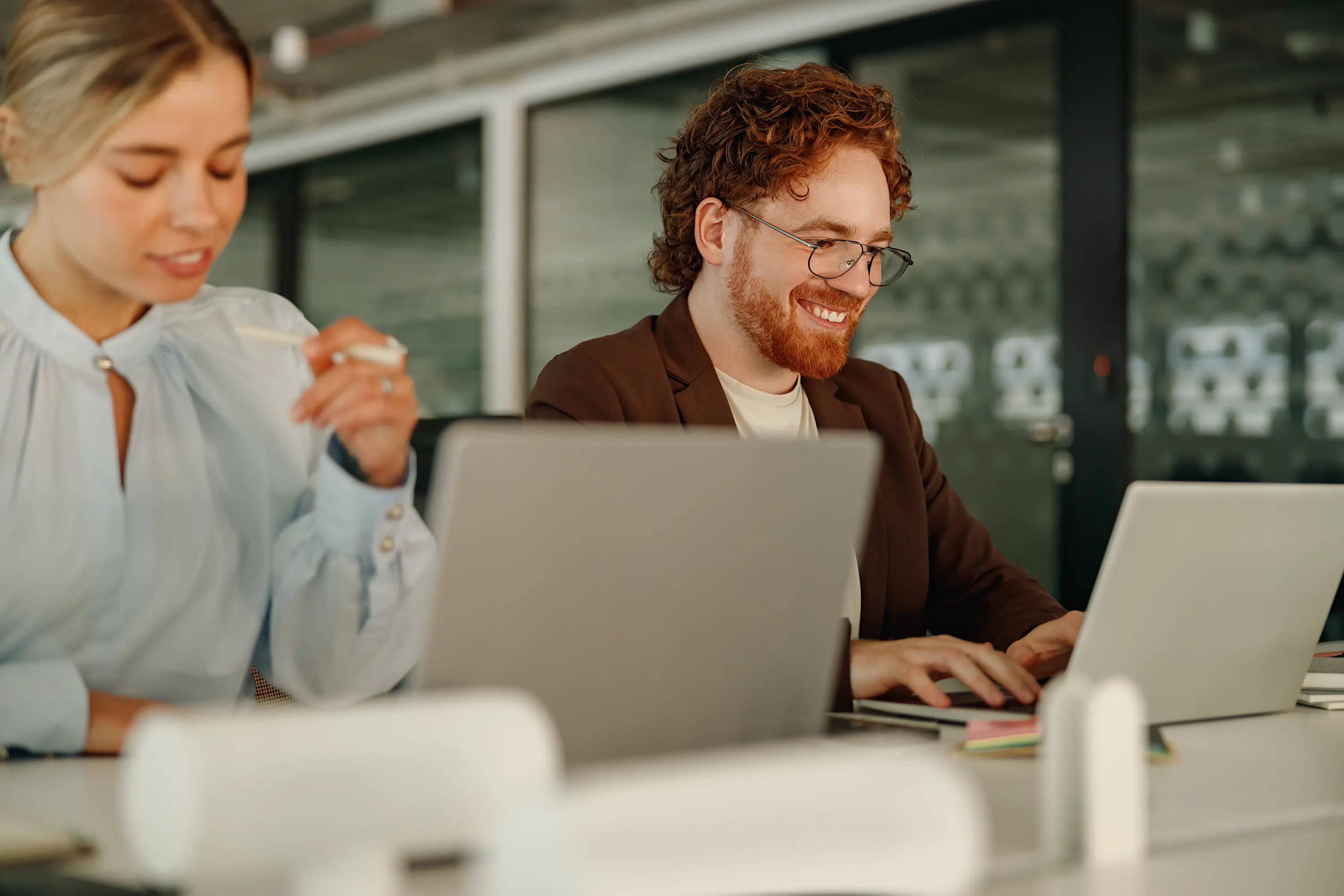 Two colleagues present in the moment together at the office